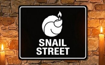 Black Snail Street sign with a white snail and flame between two candles.