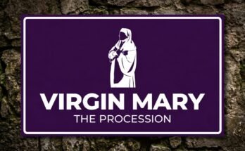 White figure of the Virgin Mary with her hands on her chest on a purple sign reading “Virgin Mary · The Procession”.