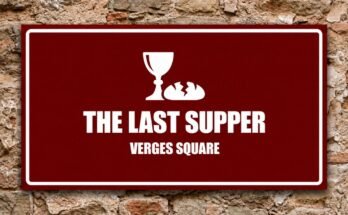 White chalice and broken bread on a red sign reading “The Last Supper · Verges Square”.