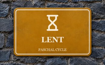 Ochre sign on a slate wall with a pictogram and the words “LENT”.
